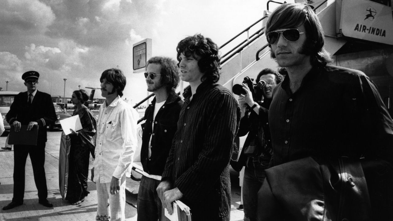 From left, Densmore, Krieger, Morrison and Manzarek arrive at the London Airport in 1968. Their third studio album, "Waiting for the Sun," was released that year.