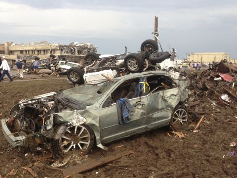 Overturned cars are among the rubble from the tornado that hit Moore on May 20.