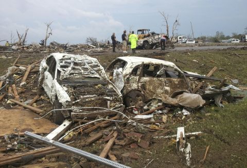 Destroyed cars scatter the landscape in Moore, Oklahoma, where hundreds of homes and buildings were put to ruin on May 20.