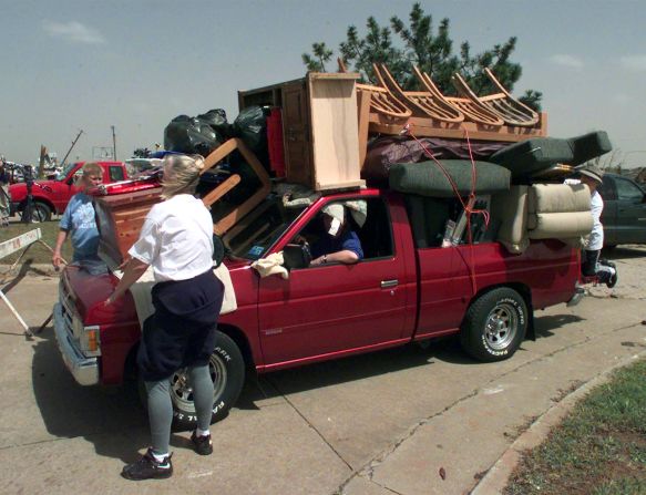 Moore residents remove possessions from their tornado-ravaged homes on May 4, 1999.
