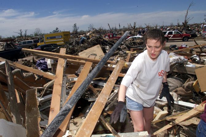 Amber Landis walks among the remains of her home in Moore, Oklahoma, which was destroyed by an EF5 tornado on May 3, 1999. Forty-six people were killed in a <a href="index.php?page=&url=http%3A%2F%2Fwww.cnn.com%2F2013%2F05%2F20%2Fus%2Foklahoma-1999-tornado%2Findex.html">string of tornadoes</a> that tore through Oklahoma on May 3, 1999, the strongest of which was an EF5 that hit the towns of Moore, Bridge Creek, Newcastle, Midwest City and Del City. Now this section of the country is dealing with <a href="index.php?page=&url=http%3A%2F%2Fwww.cnn.com%2F2013%2F05%2F20%2Fus%2Fsevere-weather%2Findex.html%3Fhpt%3Dhp_t1">a fresh disaster that has eclipsed the 1999 outbreak</a>. Click through the gallery to see more pictures from 1999: