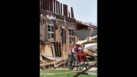 Velma Briscoe of Moore sits in front of what was her home on May 4, 1999.
