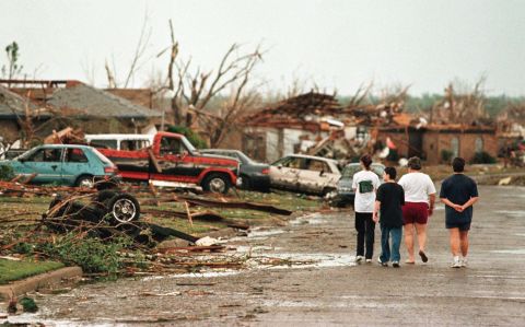 Residents survey the damage in Oklahoma City on May 4, 1999, following a series of deadly tornadoes that ravaged the state.