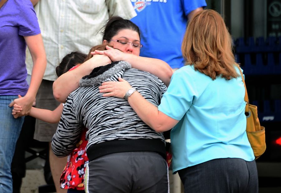 A woman is comforted after the May 20 tornado in Moore.