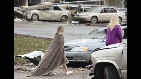 A girl wraps herself in a blanket near the Moore Hospital on May 20.