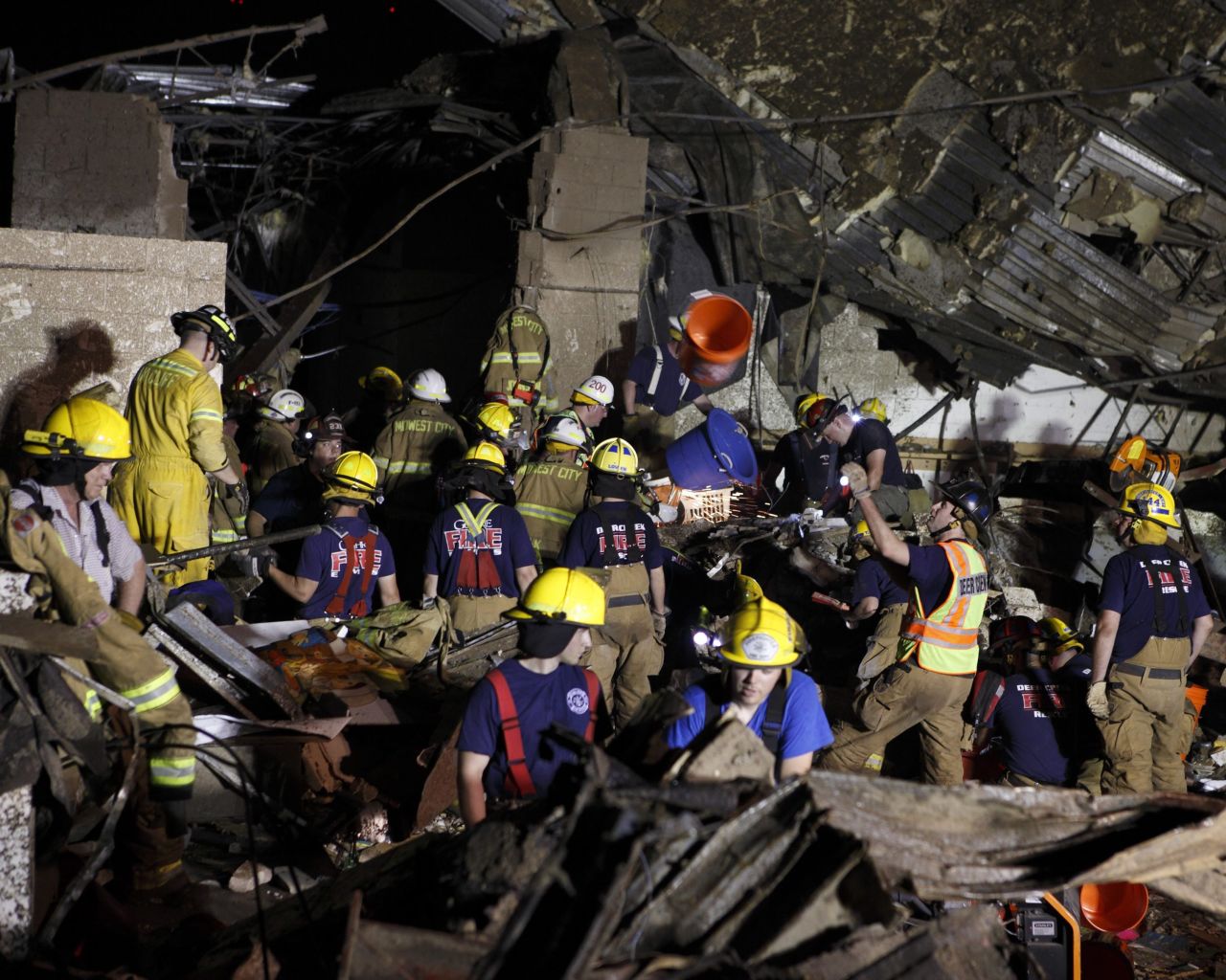 Members of the Oklahoma National Guard look for survivors in rubble in Moore on May 21.