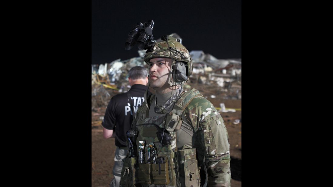 A National Guardsman assists in the search for victims on May 21. 
