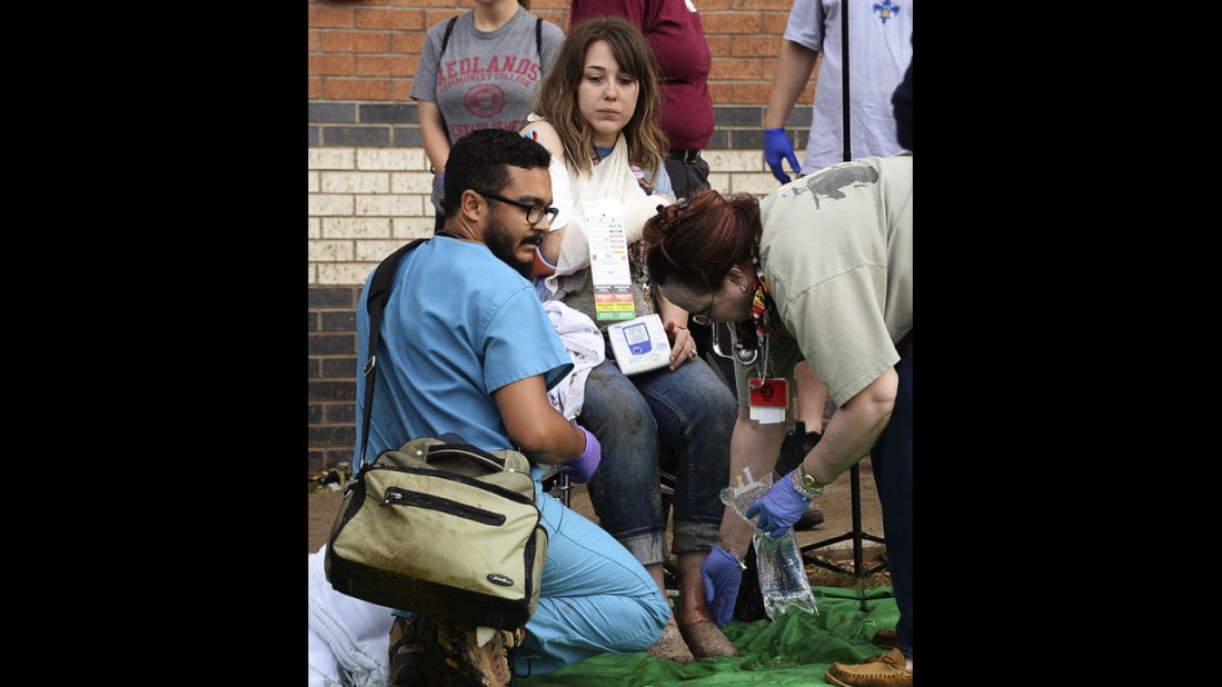 A woman is treated for her injuries on May 20 at a triage area set up for the wounded.