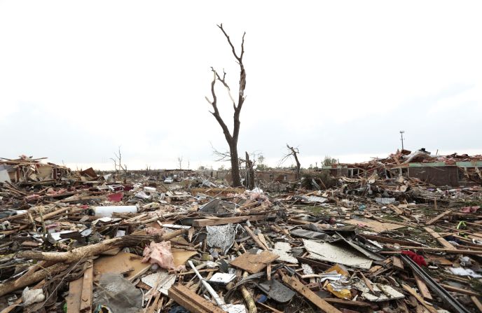 Massive piles of debris cover the ground after a powerful tornado ripped through Moore, Oklahoma, on May 20. <a href="index.php?page=&url=http%3A%2F%2Fwww.cnn.com%2F2013%2F05%2F20%2Fus%2Fgallery%2Fmoore-oklahoma-tornado%2Findex.html">View photos related to the Moore tornado.</a>