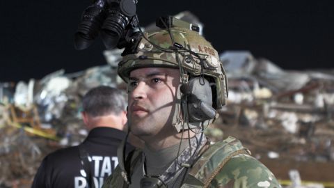A member of the Oklahoma National Guard uses night vision goggles to help in the search for survivors in Moore, Oklahoma.