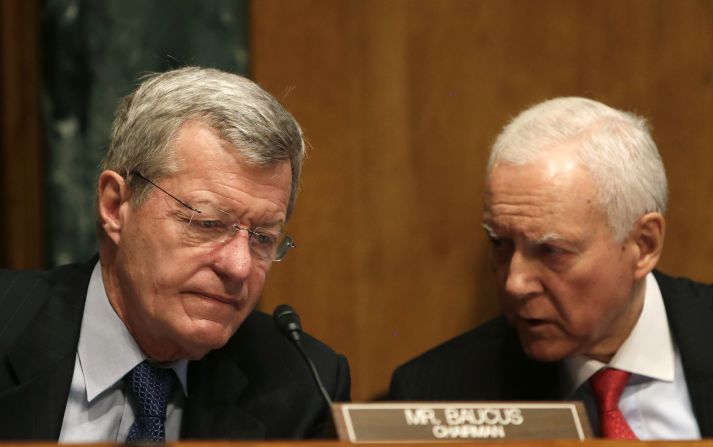 Sens. Max Baucus, left, and Orrin Hatch, co-chairmen of the Senate Finance Committee, confer in Washington in May 2013, during a hearing regarding the targeting of conservative groups.