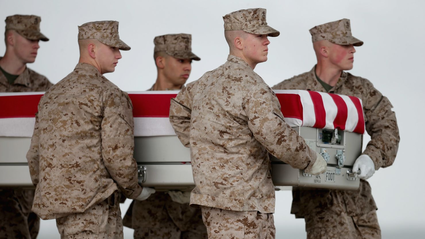 Marines just landed at Dover Air Force Base on May 7 carry the remains of one of seven troops killed in Afghanistan on May 4 .
