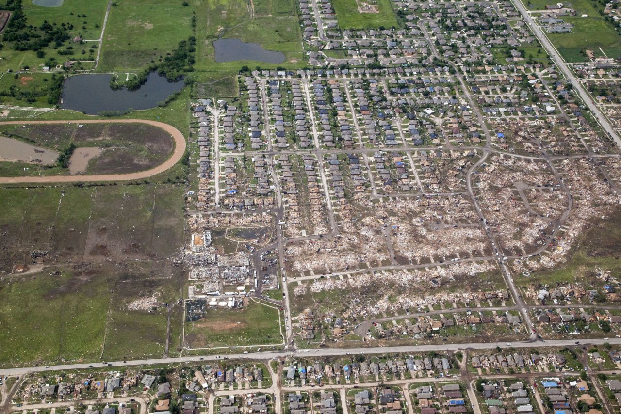 The path of the tornado is clearly visible with dirt and debris painting a wide path across the Oklahoma landscape.