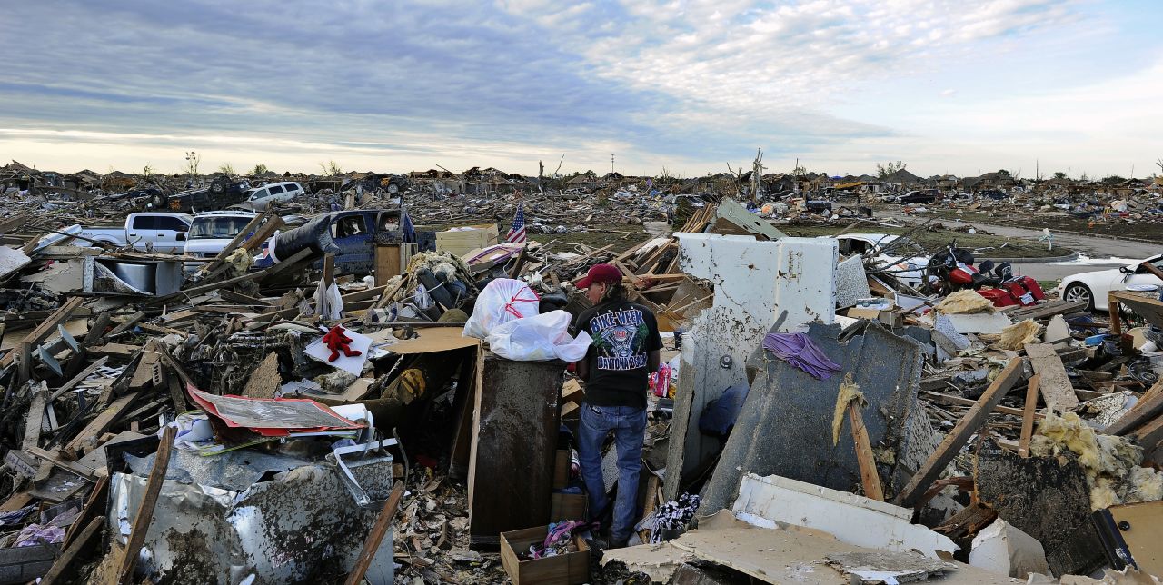 Residents salvage belongings from their demolished homes in Moore on May 21.