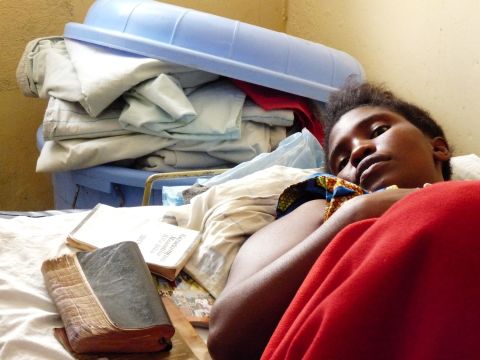 A 16-year-old girl awaits surgery at HEAL Africa hospital in the Democratic Republic of Congo. Her baby died after six days of labor, and she continuously leaks urine because of obstetric fistula.