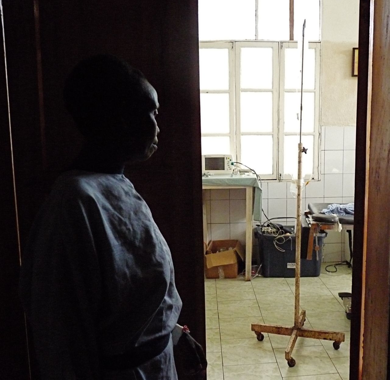 This woman, who has suffered from fistula for 20 years, watches as staff prepare for her surgery.