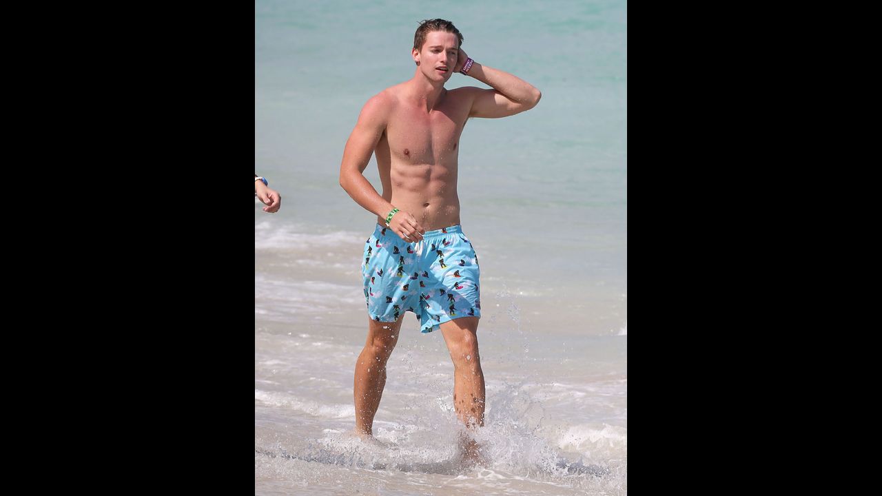 Patrick Schwarzenegger (son of Arnold and Maria Shriver) joined some friends in having a blast on the beach while on vacation in Miami in March 2013.