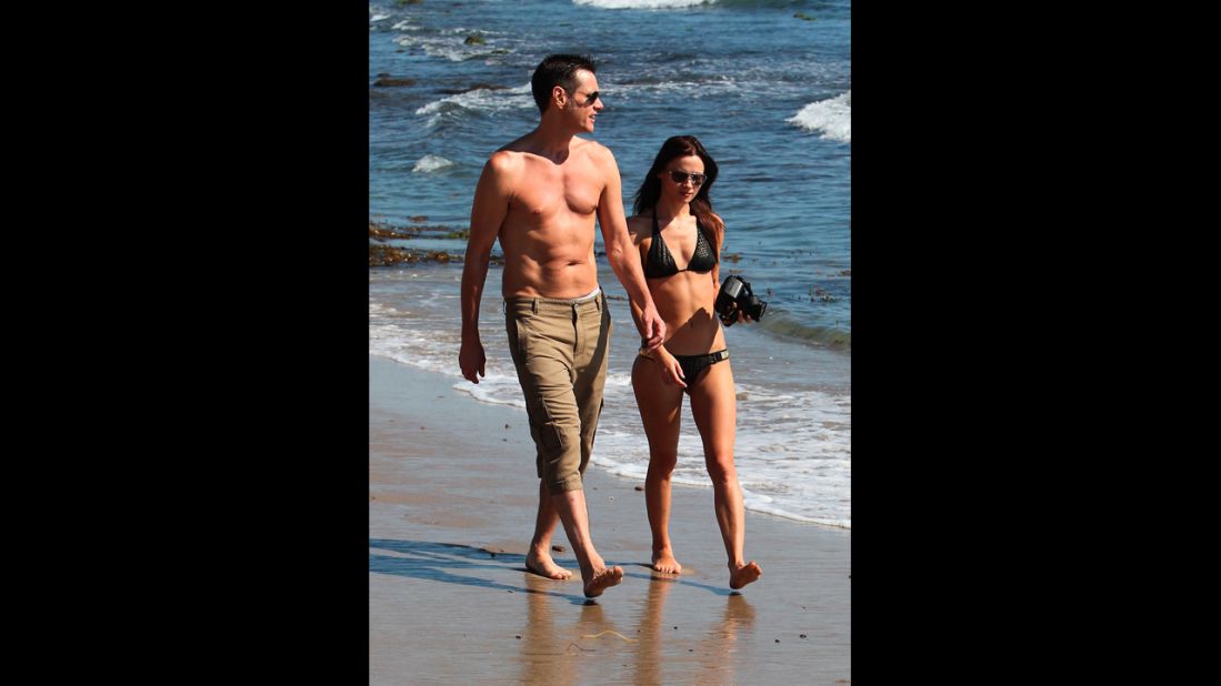 Actor Jim Carrey walked the beach in Malibu with an unidentified woman in September 2012.