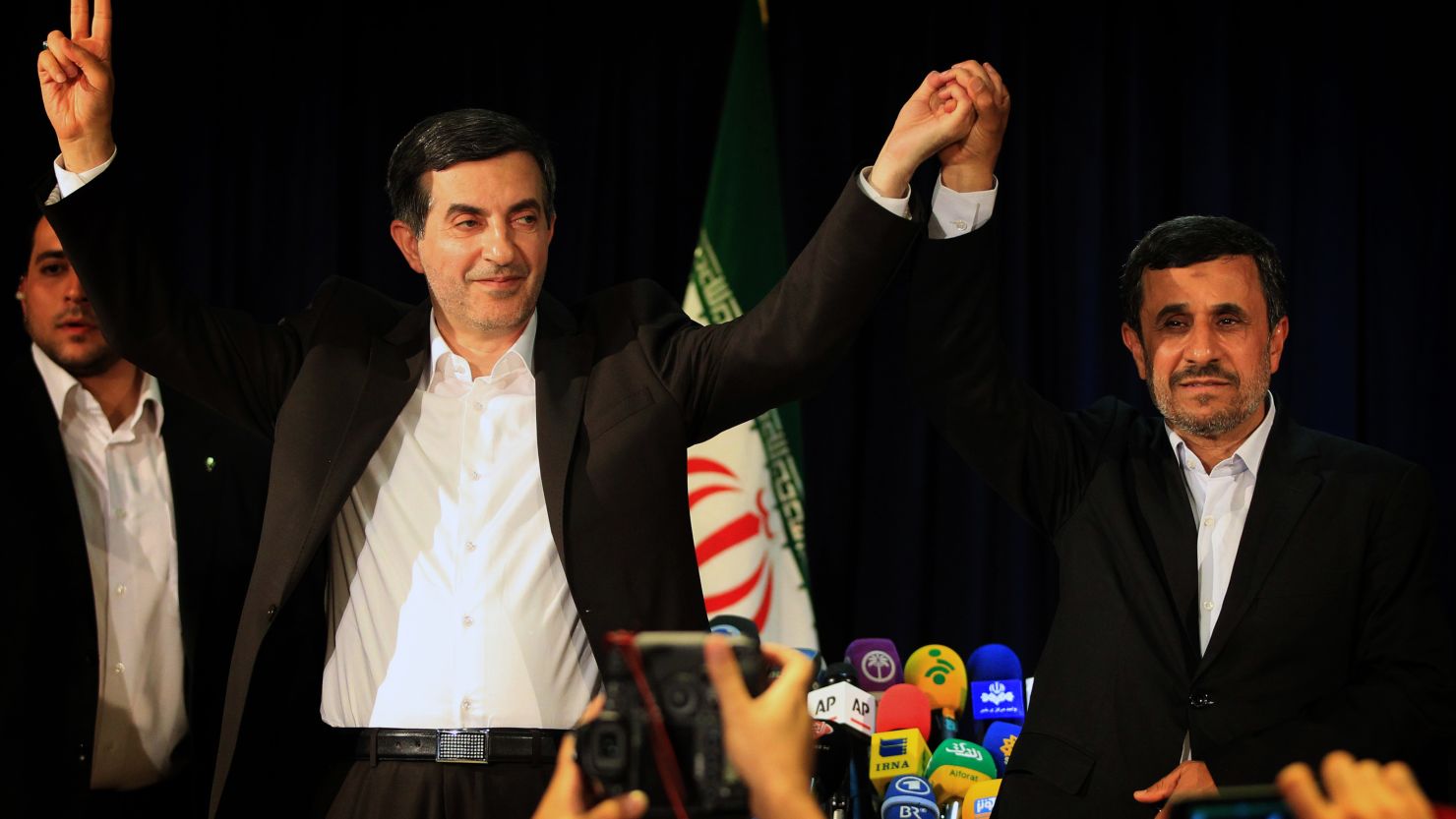 President Mahmoud Ahmadinejad, right, and Esfandiar Rahim Mashaei wave during a conference in Tehran on May 11.