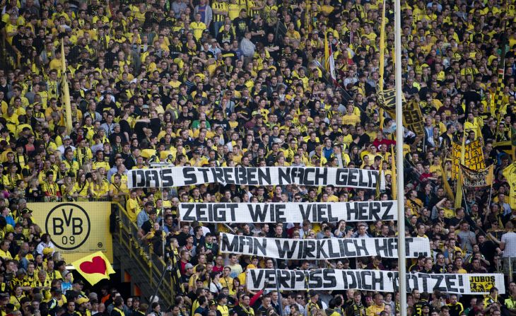 A banner reads 'The quest for cash reveals how much heart you really have, get lost Gotze' as Dortmund hosted Bayern Munich on May 4.