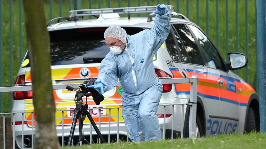 LONDON, ENGLAND - MAY 22: Scenes of Crime Officers at the scene in Woolwich following a major incident in which a man was killed, on May 22, 2013 in London, England. It has been reported that the government and police are treating the attack in Woolwich on a serving soldier as a possible terrorist attack. Police have confirmed that one man has died after being attacked in the street by two men and firearms and knives were involved in the incident. (Photo by Dan Kitwood/Getty Images)