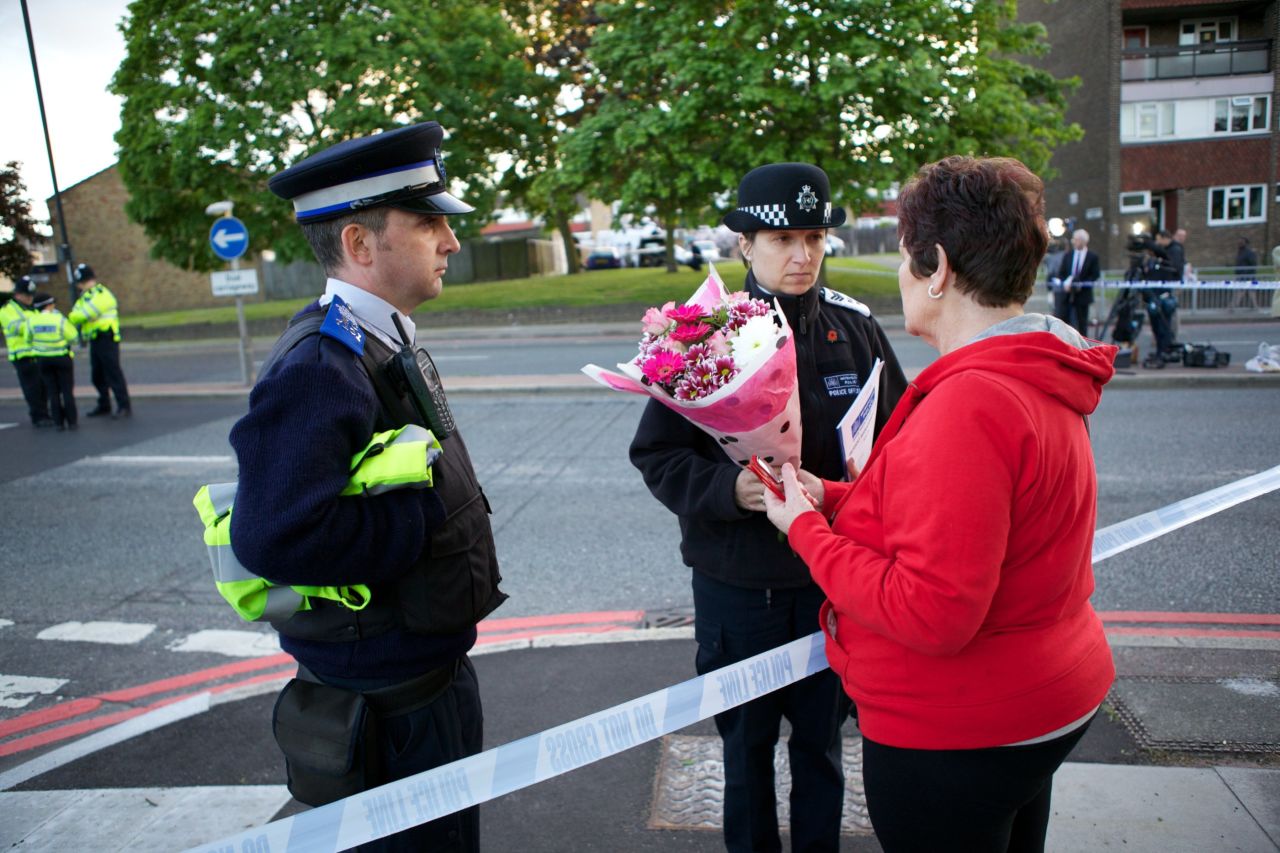 Mary Warder brings flowers to the scene of the crime on May 22 to pay respects to the victim.