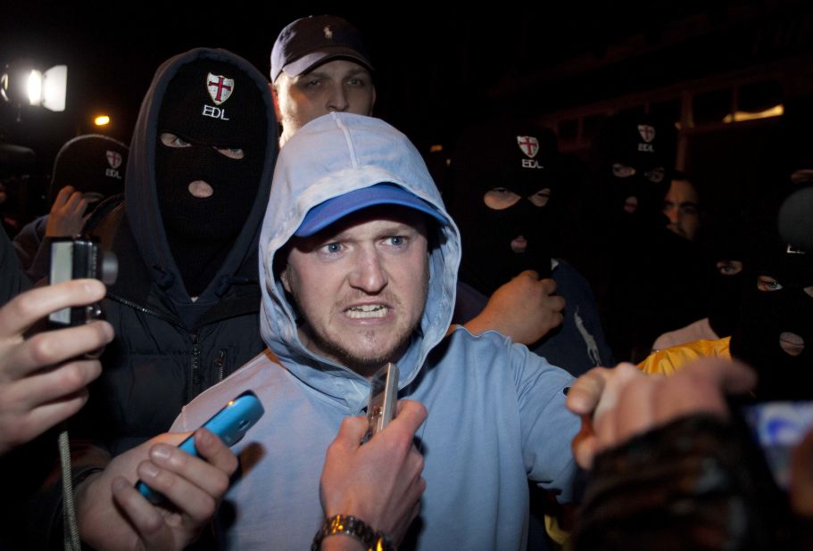 EDL leader Tommy Robinson joins supporters at the crime scene on May 22.