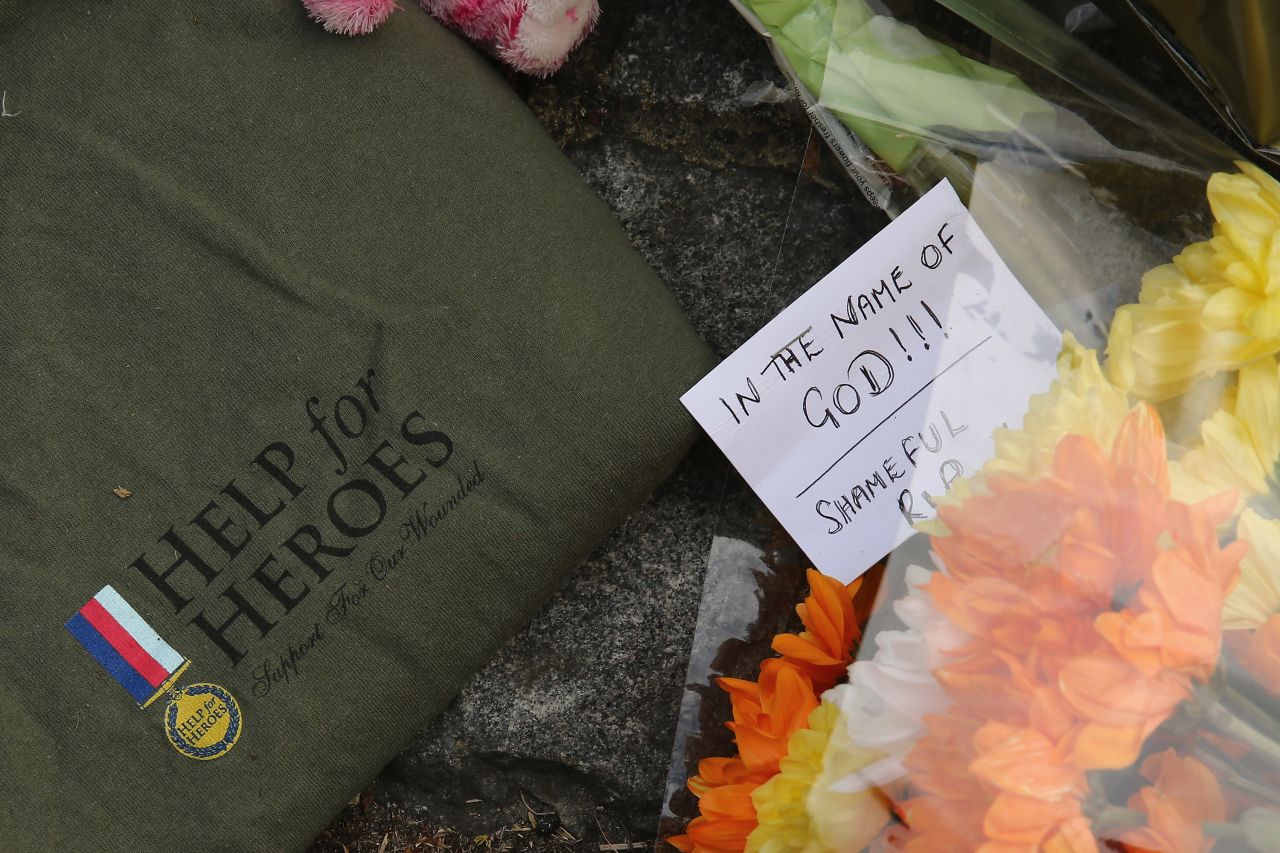 Notes and shirts sit outside Woolwich Barracks on May 23. The slain soldier was wearing a "Help for Heroes" shirt when he was killed. 