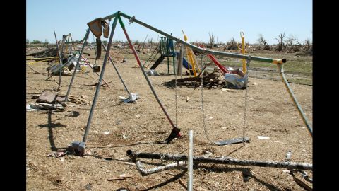 A  swing set sits warped at Plaza Towers Elementary School on May 22. 