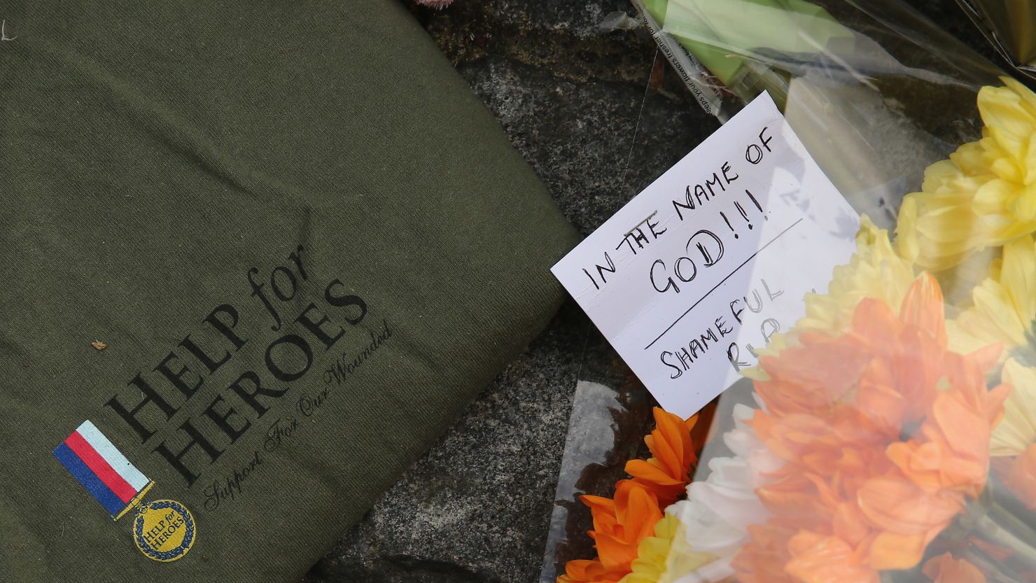 Flowers lay outside Woolwich Barracks in London, near where a British soldier was butchered in the street.