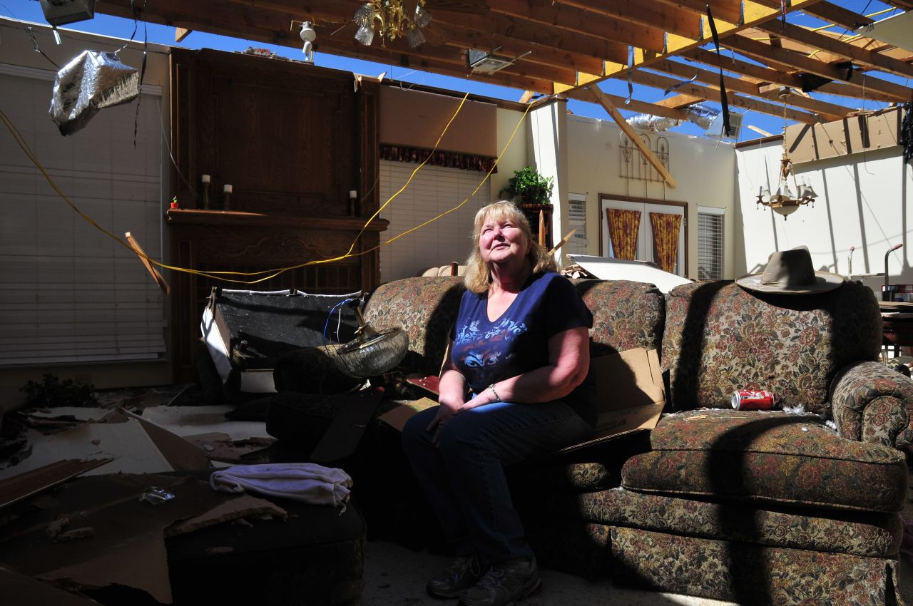 Frieda Stanley sits in what was once her living room. Her Oklahoma City neighborhood was hit by a deadly twister in May 1999 and again on Monday.