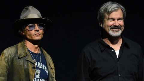 Director Gore Verbinski, right, with "The Lone Ranger" star Johnny Depp at CinemaCon on April 17, 2013.