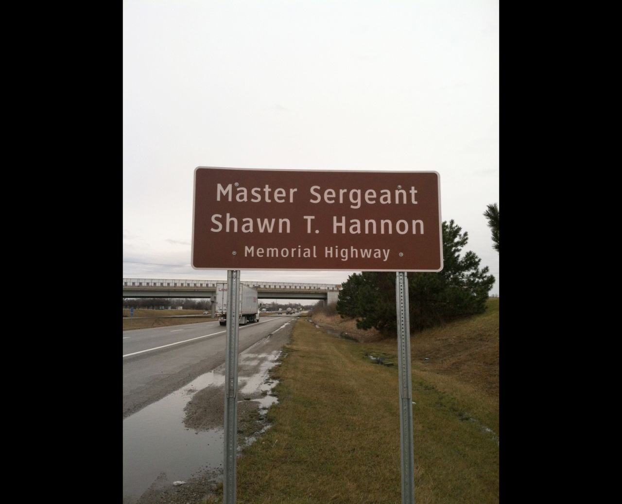 A highway sign on Interstate 71 in Grove City, Ohio, which runs near Army Master Sgt. Shawn T. Hannon's hometown. He is one of some 70 fallen soldiers memorialized in road signs along Ohio's highways.