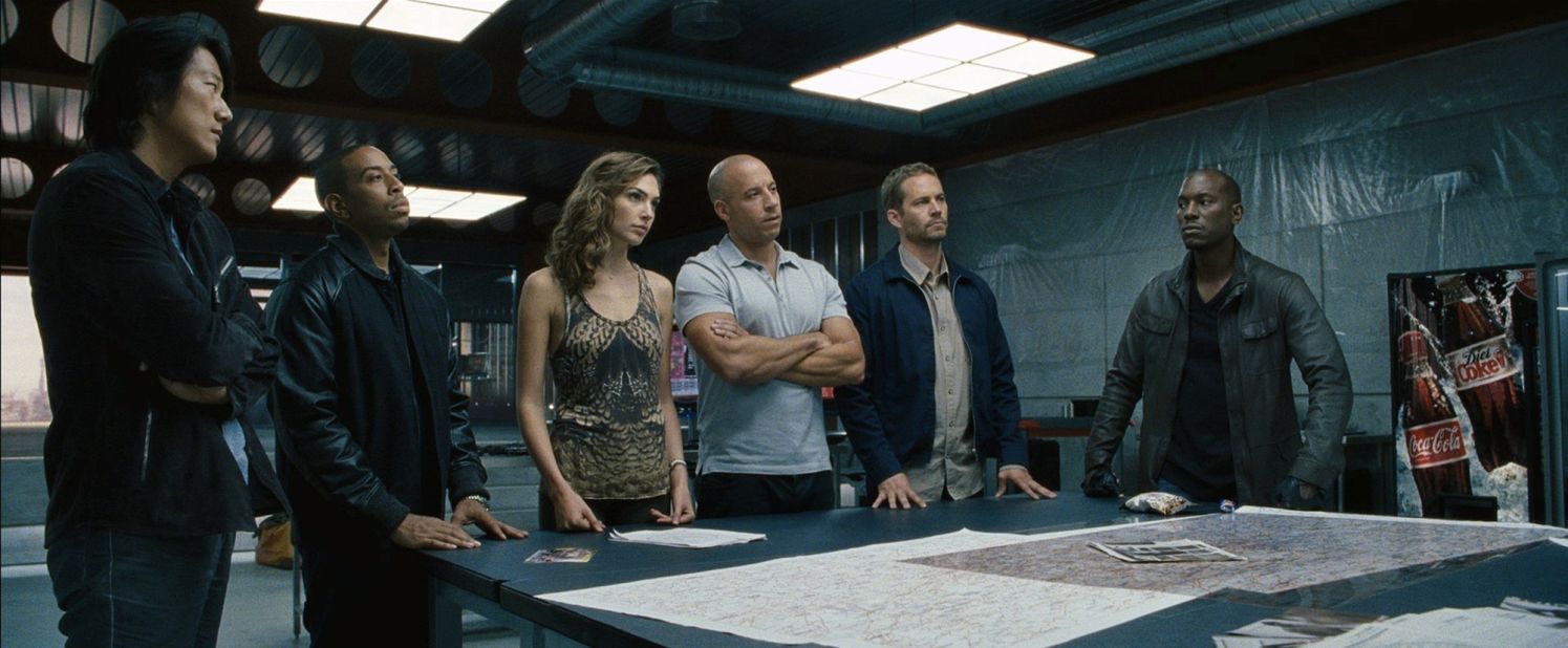 Loser: The "Fast & Furious" series faces a number of questions after the death of star Paul Walker, second from right, in November. A seventh film is in production but has been shut down in the wake of the tragedy.