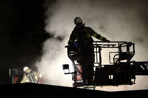 Firemen extinguish a blaze at a nursery school in the Stockholm suburb of Kista after riots in Sweden early Friday, May 24. Early media reports said the riots, which started Sunday, might have been triggered by police killing a 69-year-old man wielding a machete. But police say they are unsure of the cause.