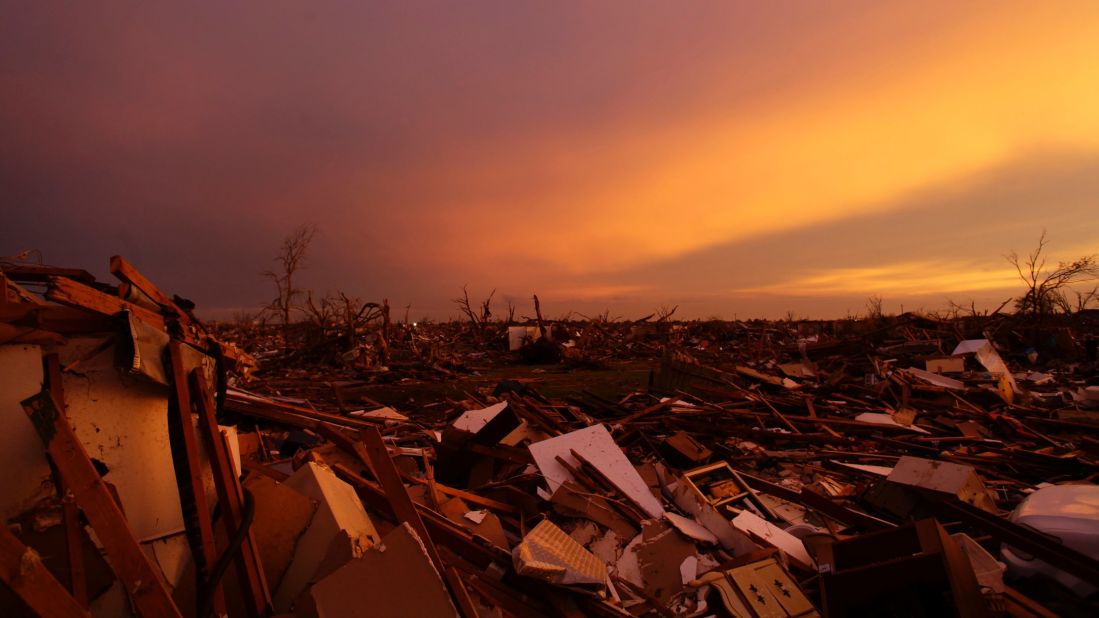 The sun sets over debris from houses littering the ground in Moore, Oklahoma, on Thursday, May 23, three days after the town was damaged by a tornado. 
