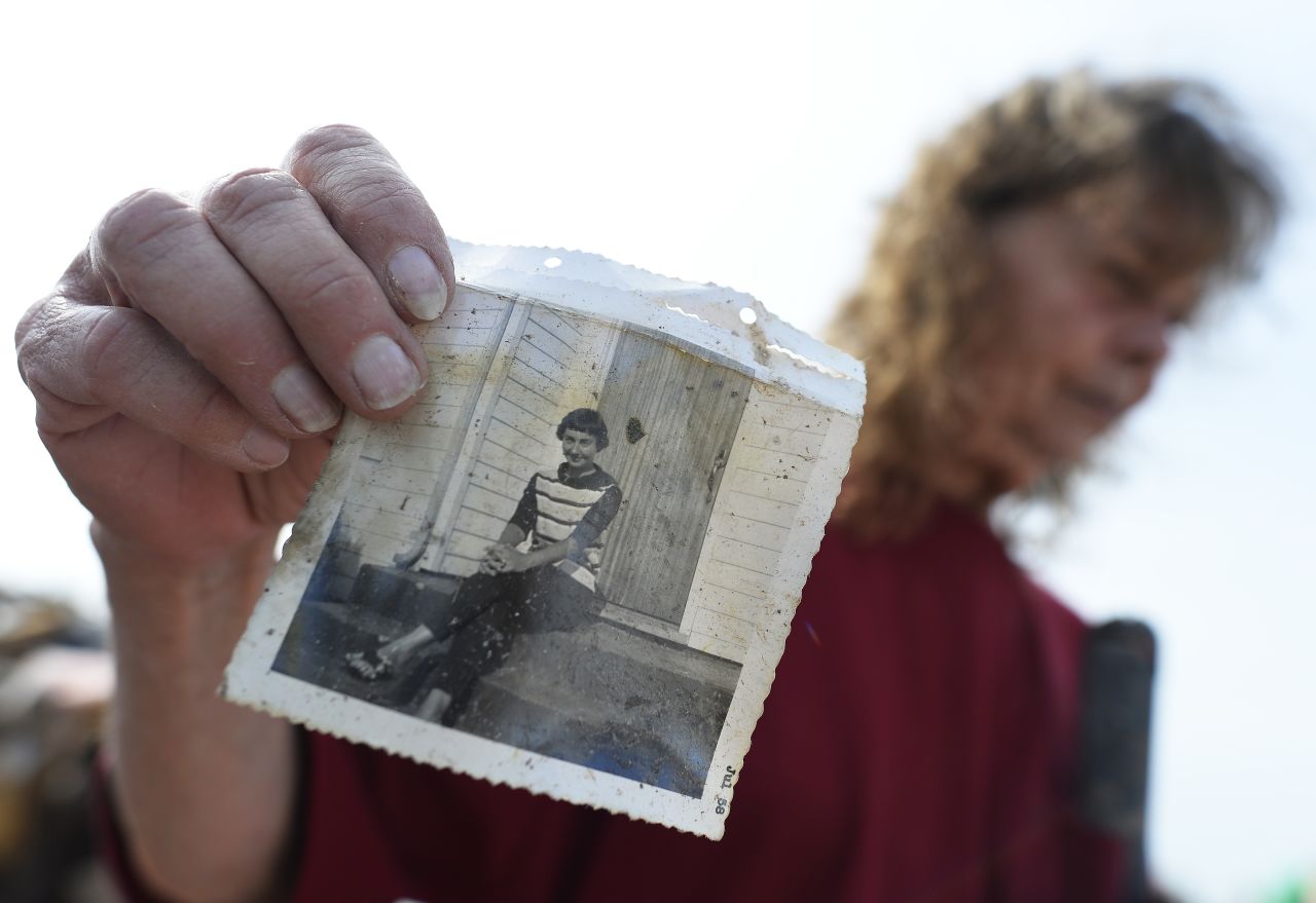 Carol Kawaykla holds a picture of her mother she found in the rubble of her tornado-devastated home in Moore, Oklahoma, on May 24.