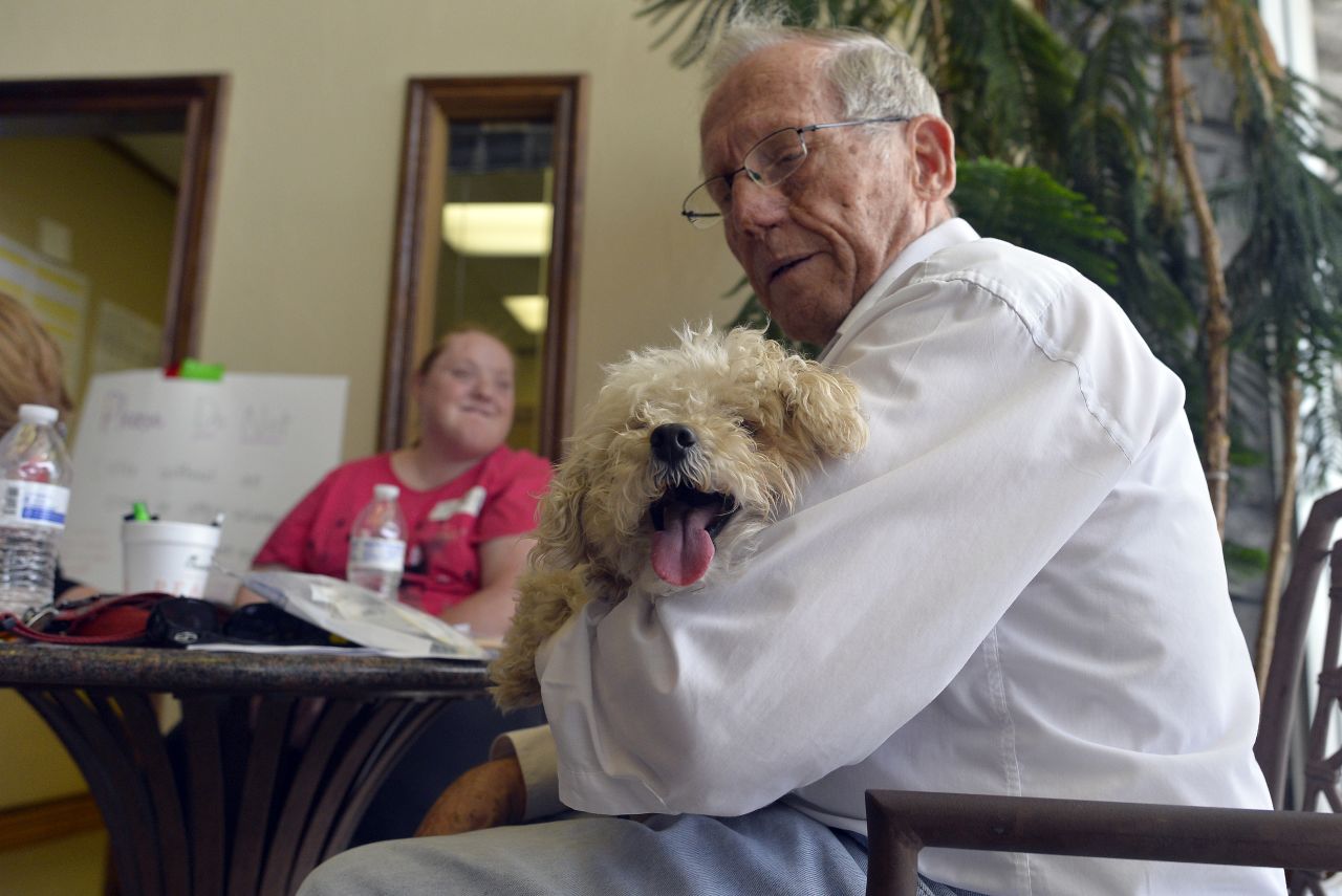 Farrell Ramsey holds his dog Tiger after he found him at an animal shelter on May 23.