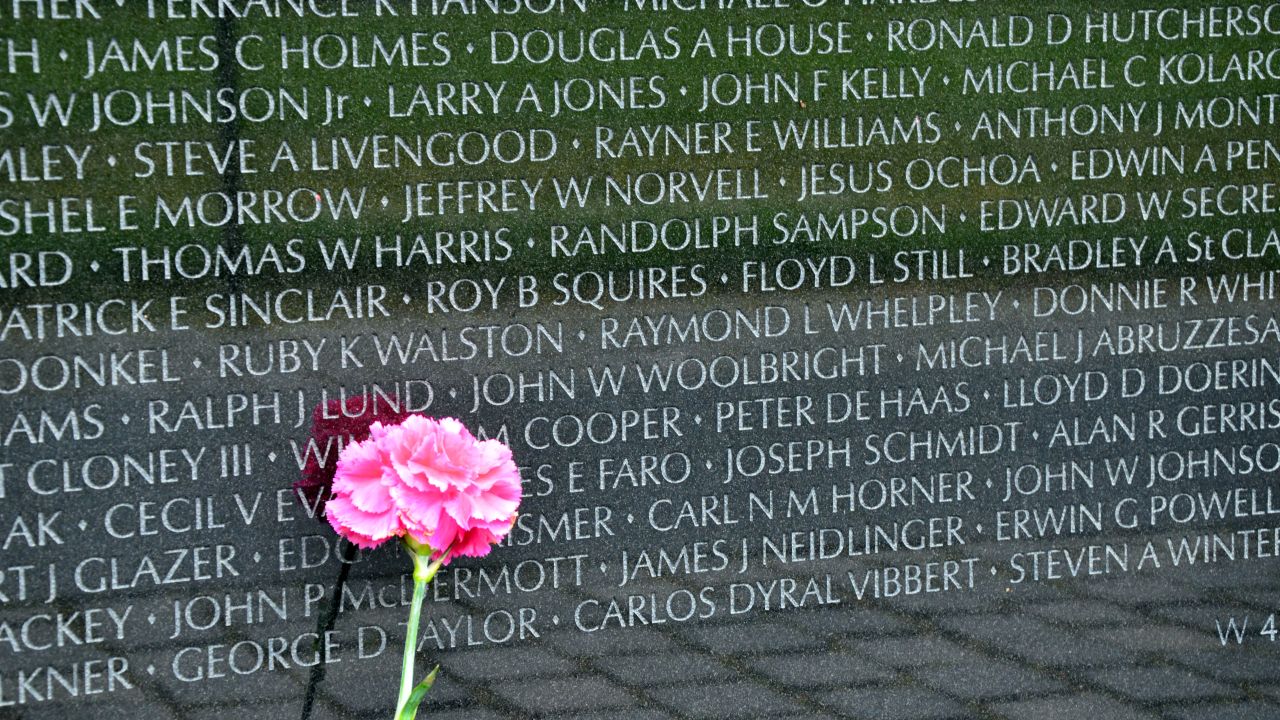 Visitors leave flowers and mementos at the Vietnam Veterans Memorial.