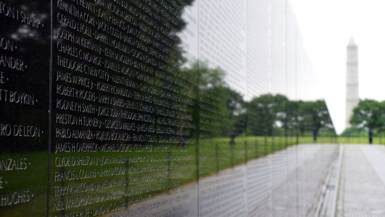 The black granite wall of the Vietnam Veterans Memorial is etched with the names of more than 58,000 Americans who died in that conflict.