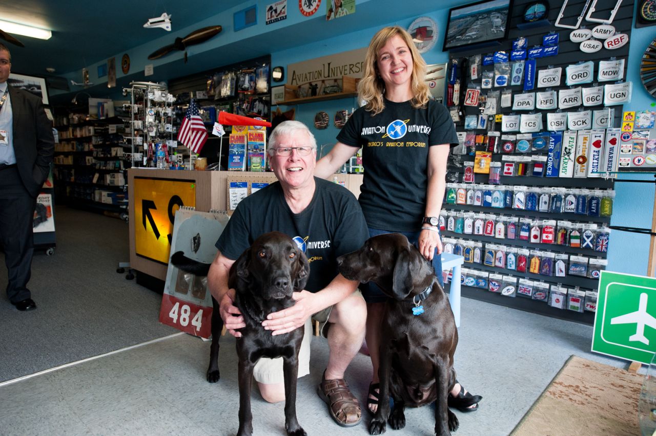Pilots Richard Wells and Lora Yowell own a Bensenville, Illinois, gift shop called Aviation Universe, which has become the unofficial headquarters of ORD Airport Watch. The shop hosts the group's Picture Nights, where they share favorite photos. Wells and Yowell named their dogs Orville and Wilbur.
