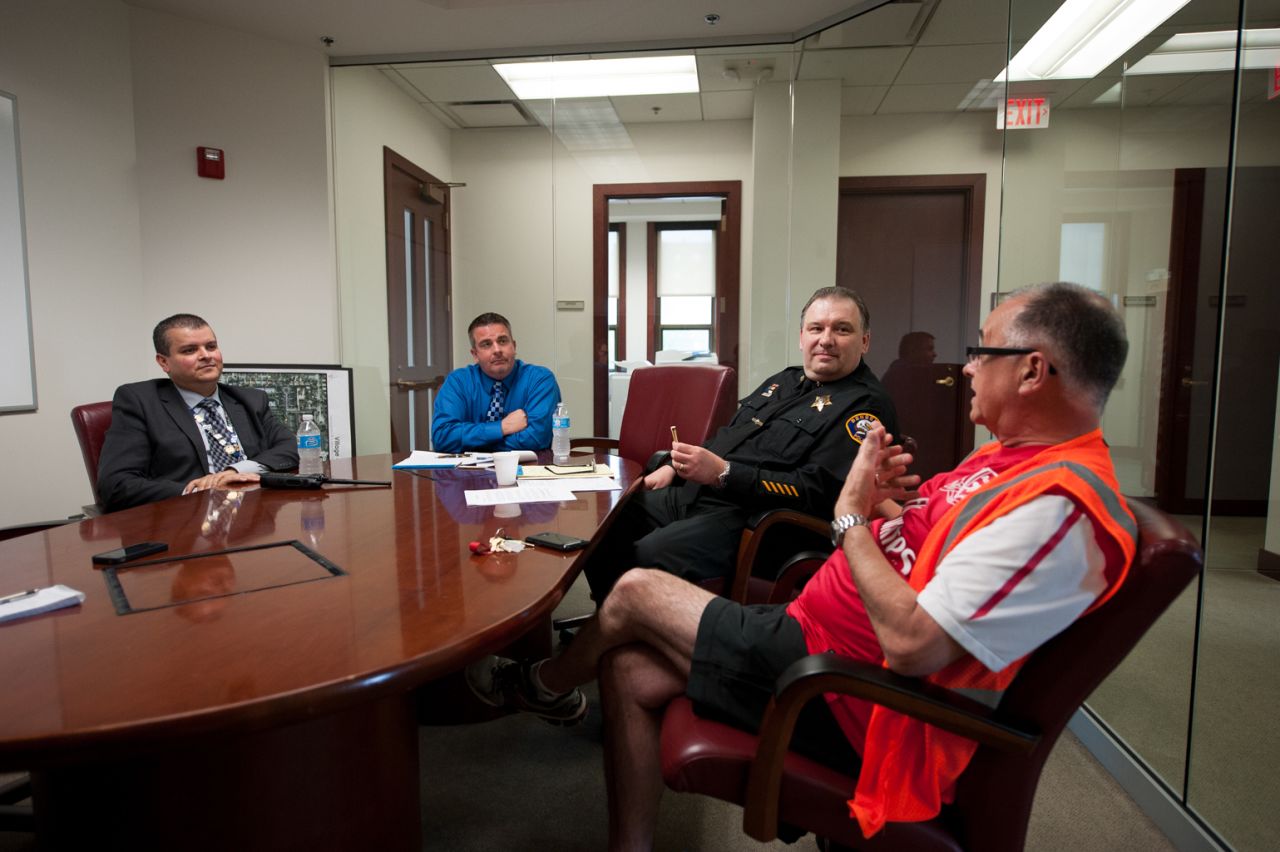 Bensenville Police Officer Joel Vargas, from left, Bensenville Village President Frank Soto and Police Deputy Chief John Lustro meet with ORD Airport Watch board member Steve Bailey. Along with local police, the spotters also meet regularly with airport authorities and officials with the TSA and FBI.