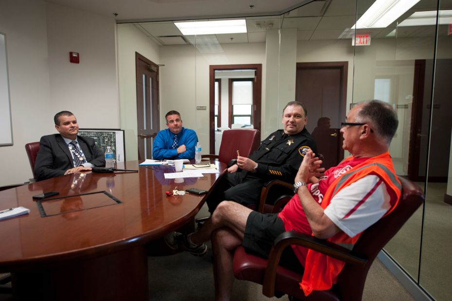 Bensenville Police Officer Joel Vargas, from left, Bensenville Village President Frank Soto and Police Deputy Chief John Lustro meet with ORD Airport Watch board member Steve Bailey. Along with local police, the spotters also meet regularly with airport authorities and officials with the TSA and FBI.