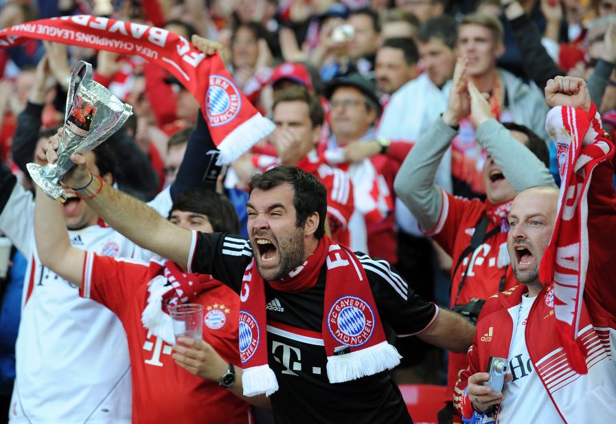 Bayern Munich supporters cheer from the stands.