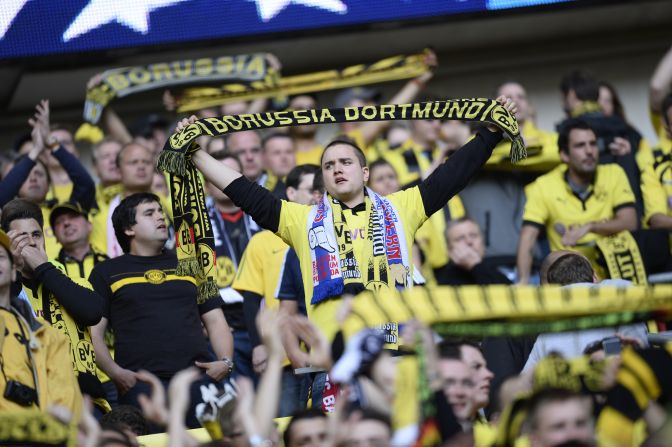 Borussia Dortmund supporters fill the stands as they wait for their team to take the field.