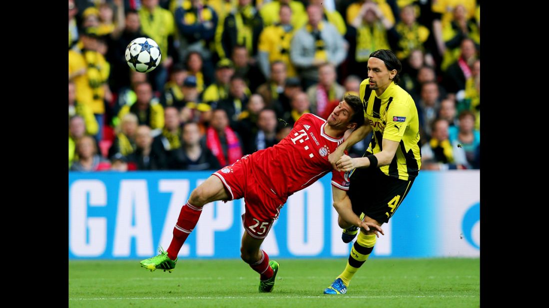 Thomas Mueller, left, of Bayern Munich goes after the ball against Neven Subotic of Borussia Dortmund during the UEFA Champions League final match at Wembley Stadium in London on May 25.