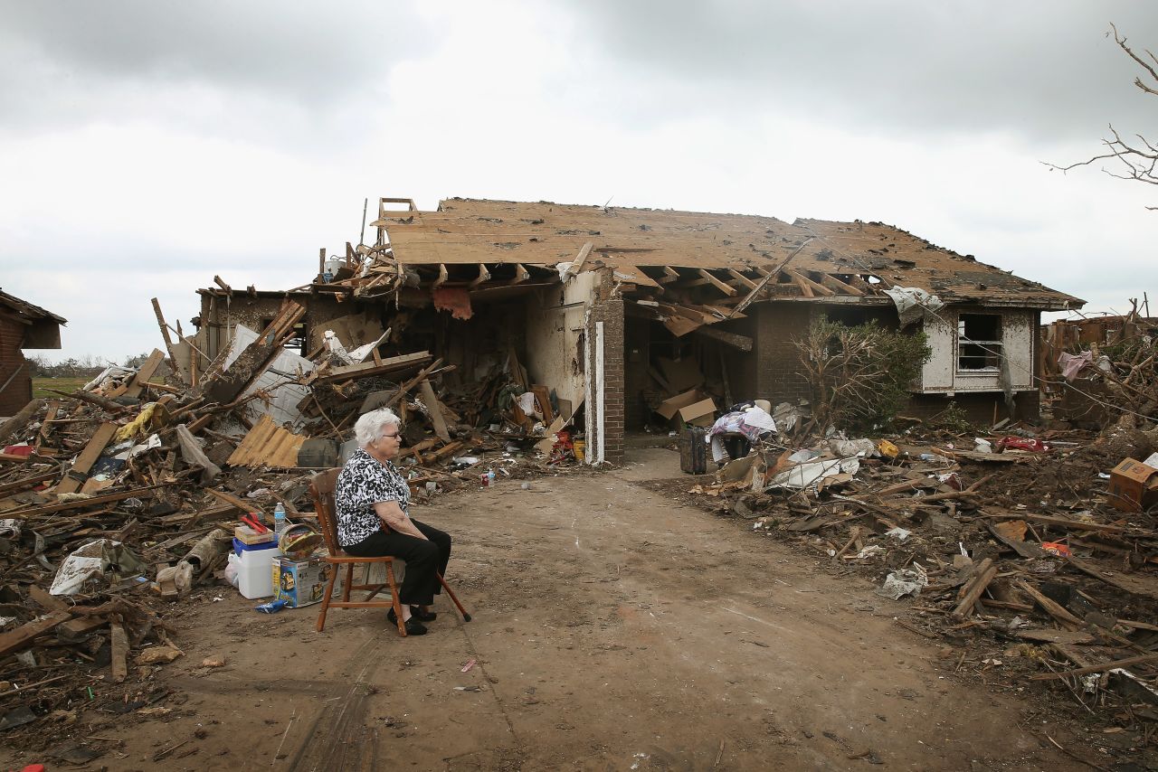Eunice Lassiter sits in the driveway of a friend's tornado-damaged home on May 25 in Moore.