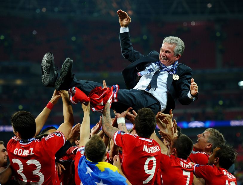 Bayern Head Coach Jupp Heynckes is carried by his players after winning the UEFA Champions League final.