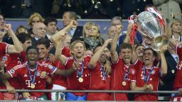 Bayern Munich players lift the trophy as they celebrate winning the UEFA Champions League final after beating Borussia Dortmund 2-1 at Wembley Stadium in London on Saturday, May 25.
