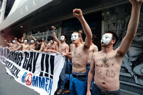 Opponents of the law  demonstrate in front of the headquarters of the Grand Orient de France, a Masonic order, in Paris on Friday, May 24. 